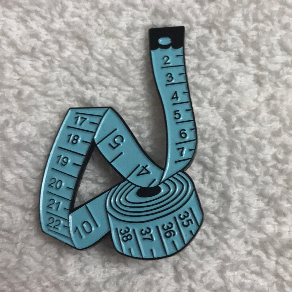 Measuring tape brooch